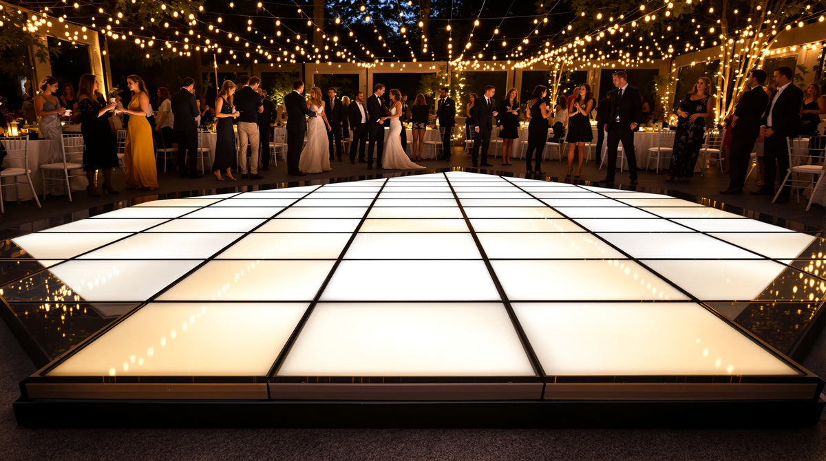8x8 LED dance floor, 4x4 tile grid of 2ft panels, glowing gold and white at a backyard tented reception