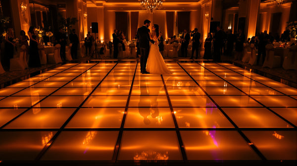 10x10 LED dance floor, 5x5 tile grid of 2ft panels, glowing gold and white in an indoor banquet hall