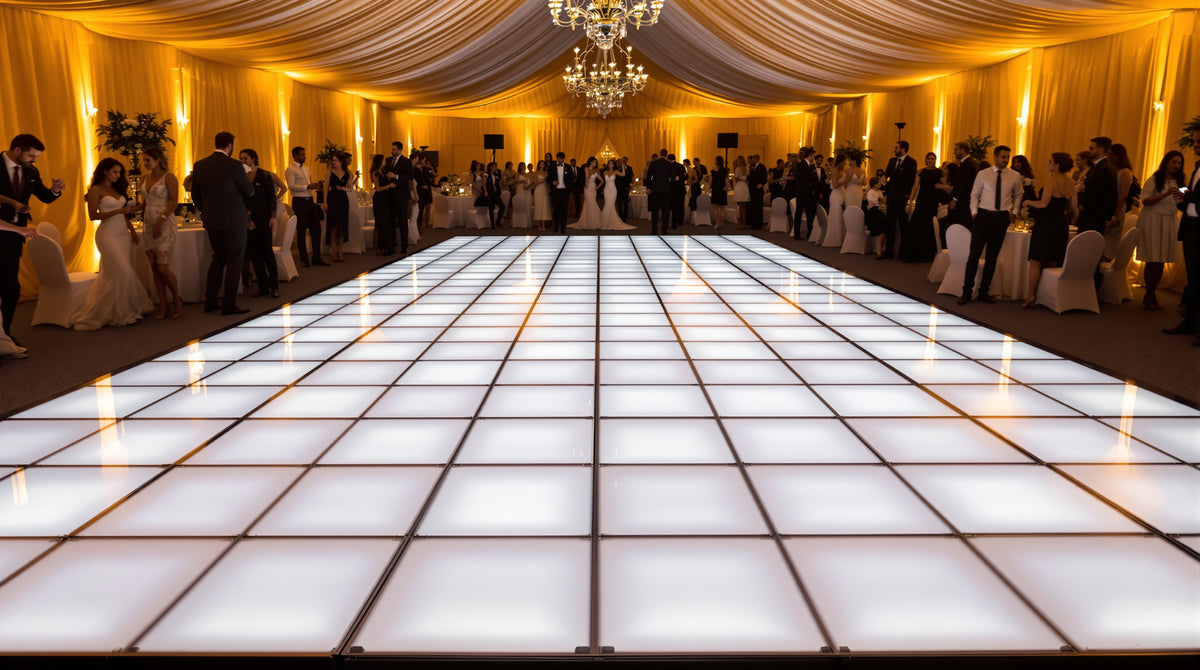 10x14 LED dance floor, 5x7 tile grid of 2ft panels, glowing gold and white in a long tented reception